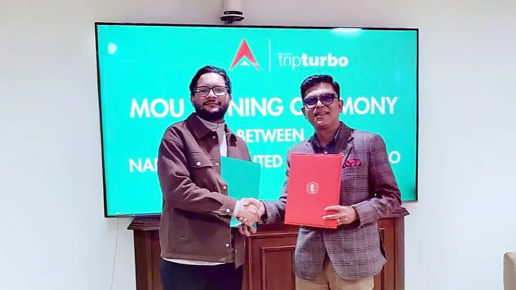 Adarsha Bazgain, Deputy Chief Executive Officer (DCEO)  at Nabil Bank Limited and Bimal Raj Paudel, Growth &amp; Marketing Lead at Trip Turbo signing MoU.